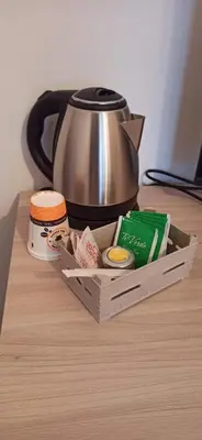 a wooden box with a tea kettle on a table at Contessa Vacanze Byron in Contessa Entellina