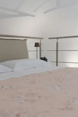 a bedroom with a white bed and a desk at Peonia Boutique Apartments in Palermo