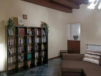 a living room with a book shelf filled with books at Casa all'Annunziata in Termini Imerese