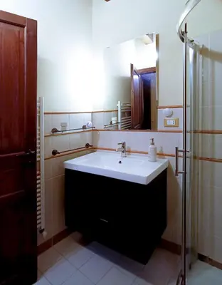 a bathroom with a large sink and a shower at Casa all'Annunziata in Termini Imerese