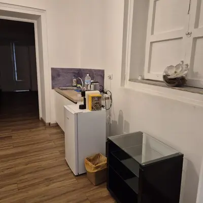 a room with a small refrigerator and a television at Quattrocantiapartments in Palermo