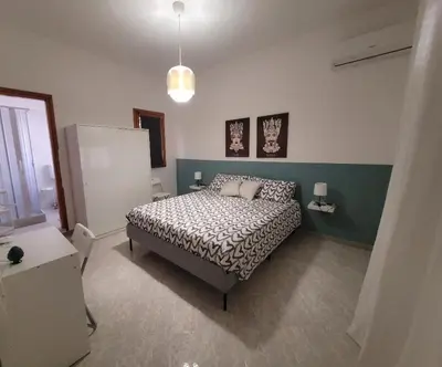 a bedroom with a bed in a room at Casa Makira in Terrasini