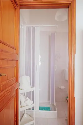 a bathroom with a shower and a toilet and a shower at Casa Makira in Terrasini