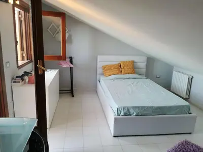 a bedroom with a bed in a attic at Villa Iris - Mondello in Palermo