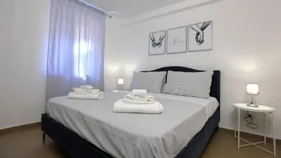 a bedroom with a bed with towels on it at Bonello House Cattedrale in Palermo