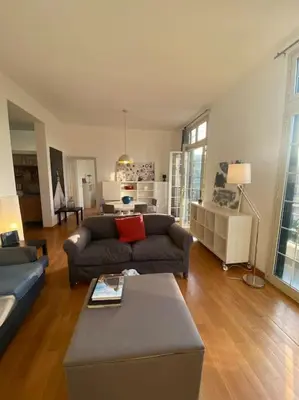 a living room with a couch and a table at POLITEAMA SUITE IN THE HEART OF THE CITY in Palermo