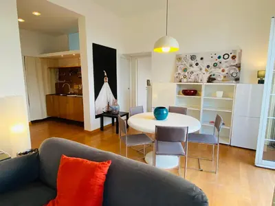 a living room with a couch and a table at POLITEAMA SUITE IN THE HEART OF THE CITY in Palermo