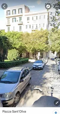 a row of cars parked on the side of a street at POLITEAMA SUITE IN THE HEART OF THE CITY in Palermo
