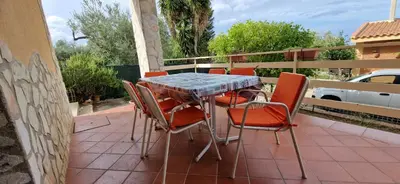 a table and chairs sitting on a patio at Villa San Lorenzo Sicily in Altavilla Milicia