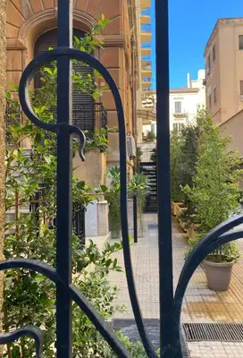 a wrought iron gate in front of a building at Casa 3D'Oro Palermo in Palermo