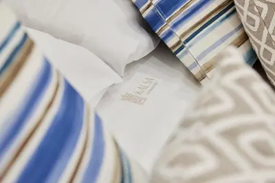 a close up of a white tie and other ties at Kalsa Sicilian Rooms in Partinico
