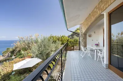 a balcony with a view of the ocean at Solemar Sicilia - Villa Corallo in Bagheria
