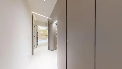 a hallway with white walls and a row of mirrors at Carletta's Aparta-Suite & Spa in Palermo