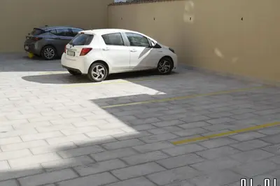 a white car parked in a parking lot at Simply the best - apartment and parking space by Balsamotto in Palermo