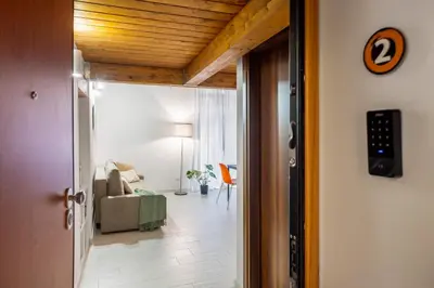 a hallway leading to a living room with a couch at Open Sicily Homes - Near the Central Train Station in Palermo