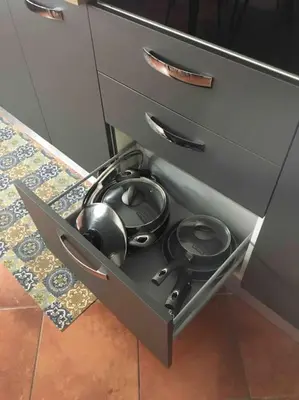 a drawer with some pots and pans in it at Alloggio incantevole/ bedsitting-room in Altavilla Milicia