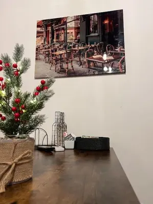 a christmas tree sitting on a table in a room at Central Cathedral Apartment in Palermo