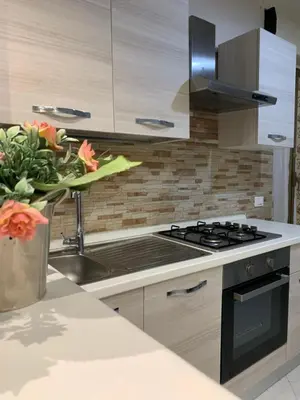 a kitchen with a stove and a sink at Casa Leila in Palermo