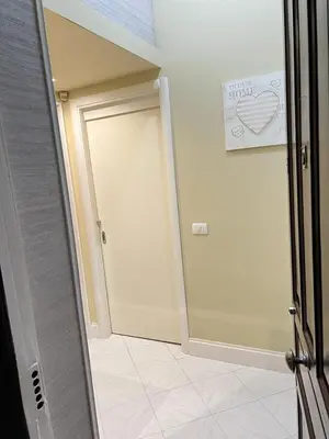 a hallway with a door with a heart sign on it at Casa Leila in Palermo