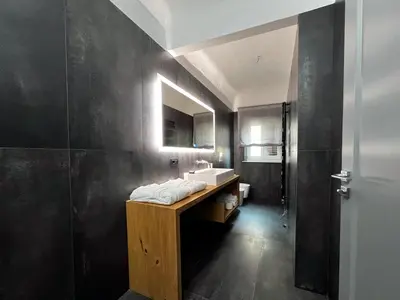 a bathroom with a sink and a mirror at Gioiamia - Luxury Rooms in Cattedrale in Palermo