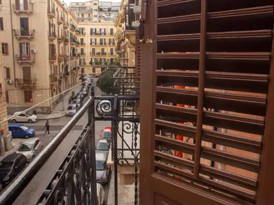 a view of a street from a balcony at Pacini Deluxe Apartment in Palermo