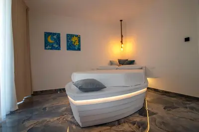 a bedroom with a bed in a room with at Hotel Arte Mare in San Vito lo Capo