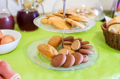 two plates of pastries and cookies on a table at B&B Giardino dei Cedri in Trabia