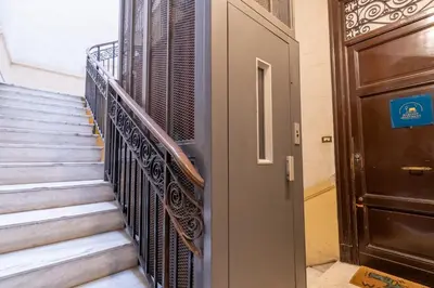 a set of stairs next to a door at MARIANO APARTMENT Palermo in Palermo