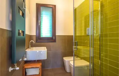 a bathroom with a sink and a toilet and a shower at Gorgeous Home In Trabia With Wifi in Trabia