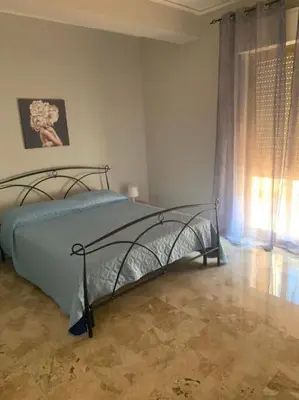 a bedroom with a bed and a window at D'Kasa Mia Capaci in Capaci