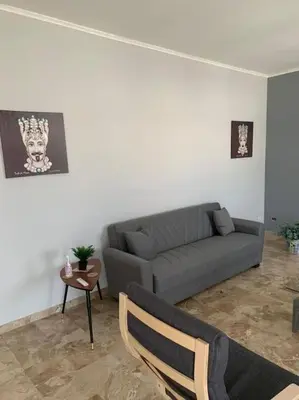 a living room with a couch and a table at D'Kasa Mia Capaci in Capaci