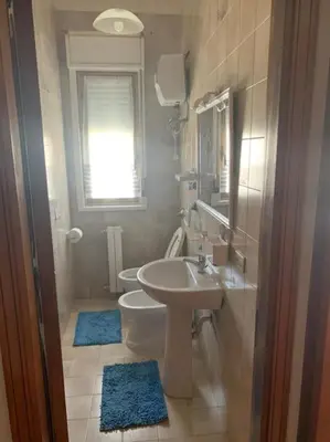 a bathroom with a sink and a toilet and a mirror at D'Kasa Mia Capaci in Capaci