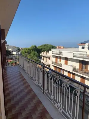 a balcony with a view of a city with buildings at D'Kasa Mia Capaci in Capaci