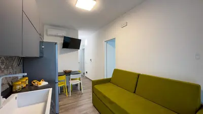 a bedroom with a bed and a window in it at Aura di Grecale in San Vito lo Capo