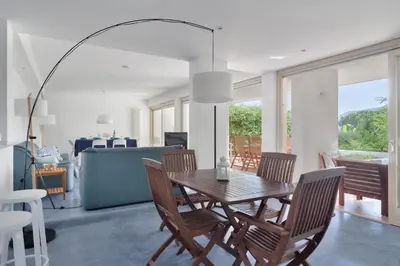 a dining room with a table and chairs at Hector's House by DomuSicily in Palermo