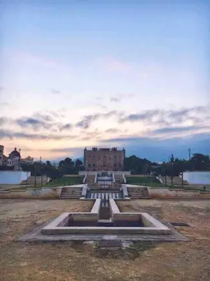 a building with a fountain in the middle of a field at Casa di Giulietta in Palermo