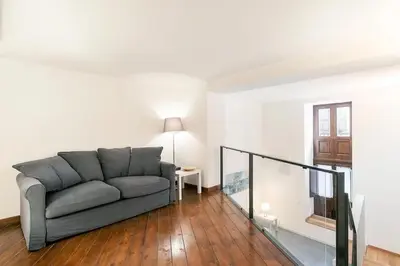a living room with a couch and a table at Casa Musicò in Palermo