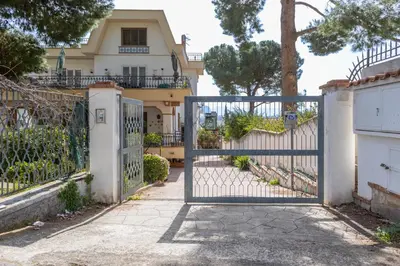 a gate in front of a house at Casa in Villa a Mondello-700m dal mare in Palermo