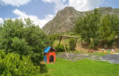 a playground with a swing set and a swing set at Amazing Home In San Giuseppe Jato in San Giuseppe Jato