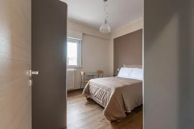 a bedroom with a bed and a window at Appartamento Libertà con Terrazza by Wonderful Italy in Palermo