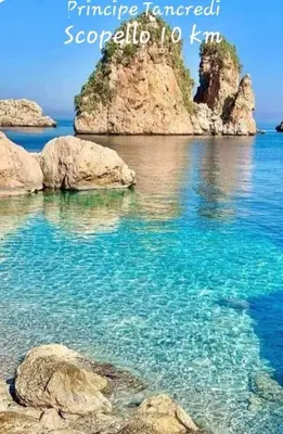 a large body of water with rocks in it at Principe Tancredi in Castellammare del Golfo