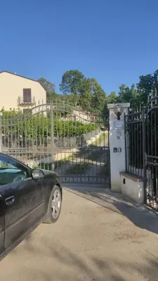 a car parked in front of a gate at Villa Laura in Cefalù