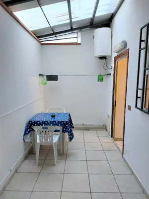 a table and a chair in a room at CASA di ARTHUR in Palermo