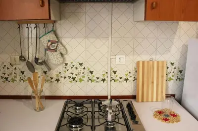 a kitchen with a stove and a counter top at Sicilia Nica - appartamento privato a Cinisi (PA) in Cinisi