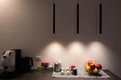 a table with a bowl of fruit and a coffee maker at Monolocale Ramondetti Fileti in Palermo