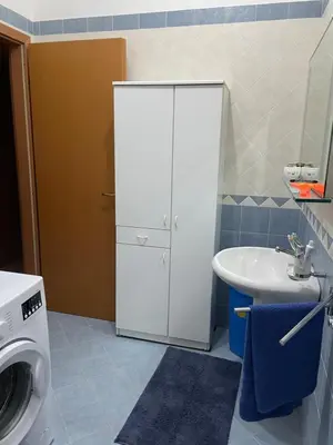 a bathroom with a washing machine and a sink at Belmare trilocale a piano terra indipendente in San Vito lo Capo