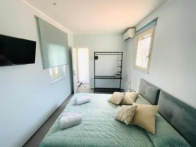 a bedroom with a bed with pillows on it at Dimora San Gregorio Luxury Rooms in Palermo