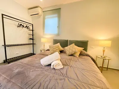 a bedroom with a bed with a towel on it at Dimora San Gregorio Luxury Rooms in Palermo