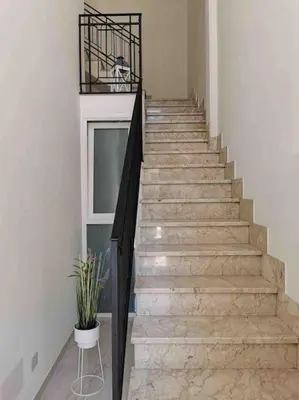 a staircase in a house with a plant on it at Lovely apartment in Castellammare del Golfo in Castellammare del Golfo