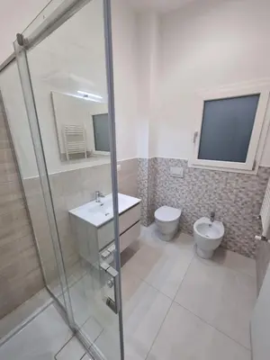 a bathroom with a shower and a sink and a toilet at Lovely apartment in Castellammare del Golfo in Castellammare del Golfo